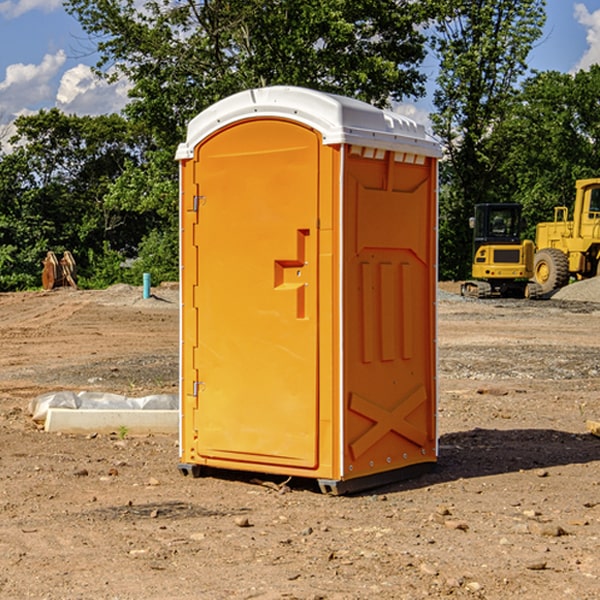 what is the cost difference between standard and deluxe portable restroom rentals in Rachel